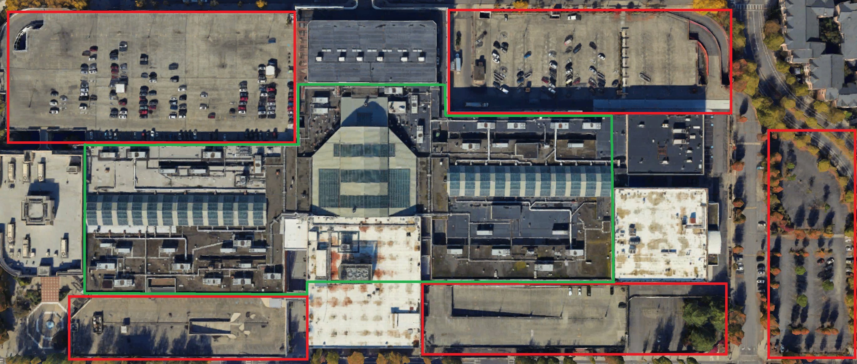 Overhead of the mall roofs. A green outline marks the core. Red outlines mark the parking garages around it.